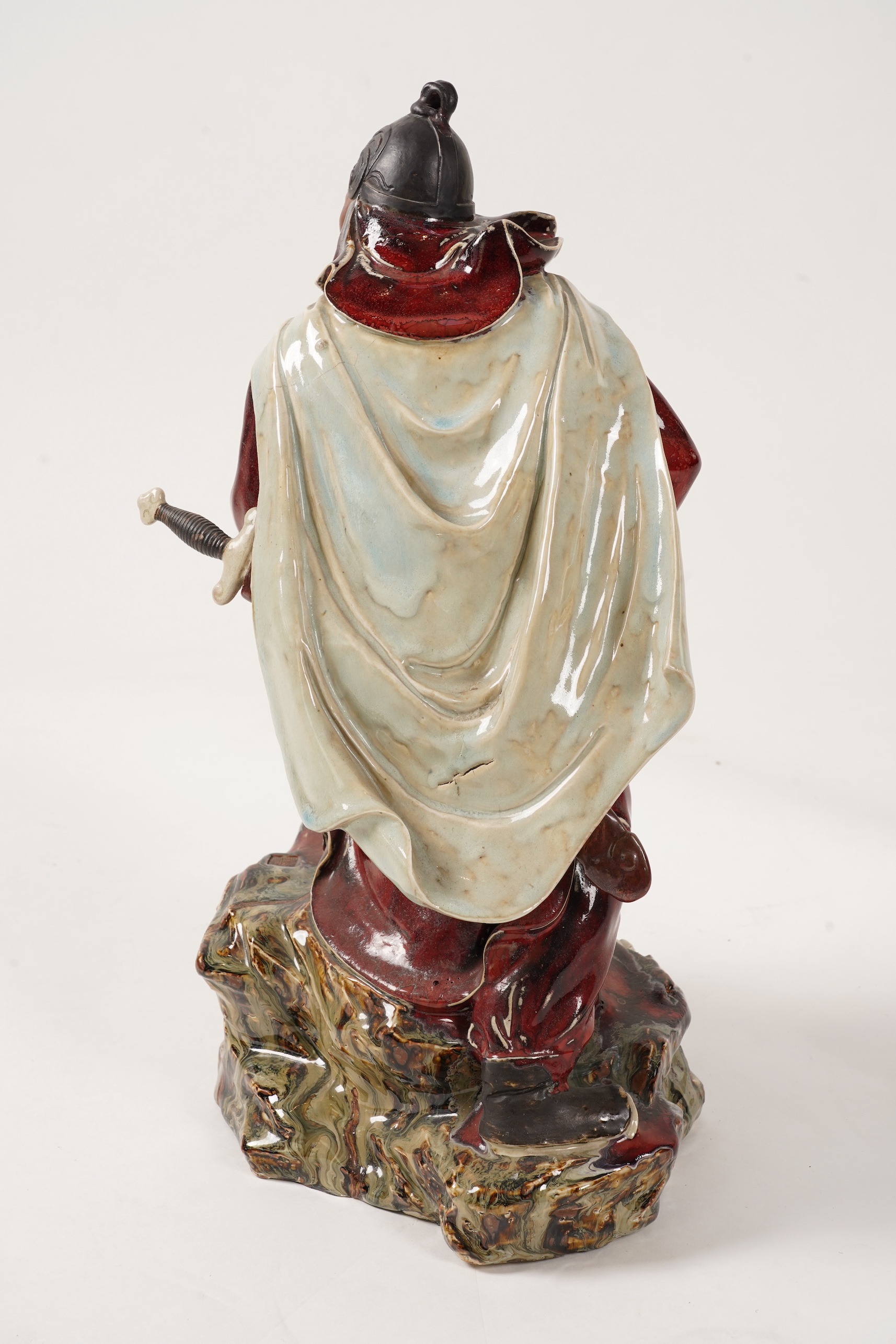 A large Chinese Shiwan stoneware figure of a warrior, 20th century